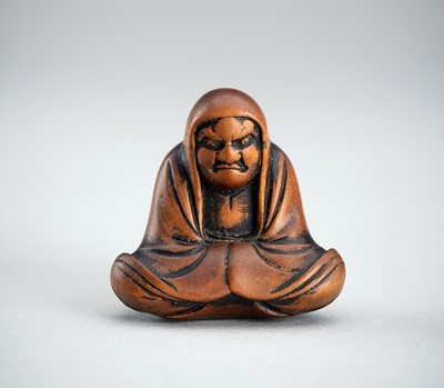 Lot 688 - A BOXWOOD NETSUKE OF DARUMA, EDO PERIOD