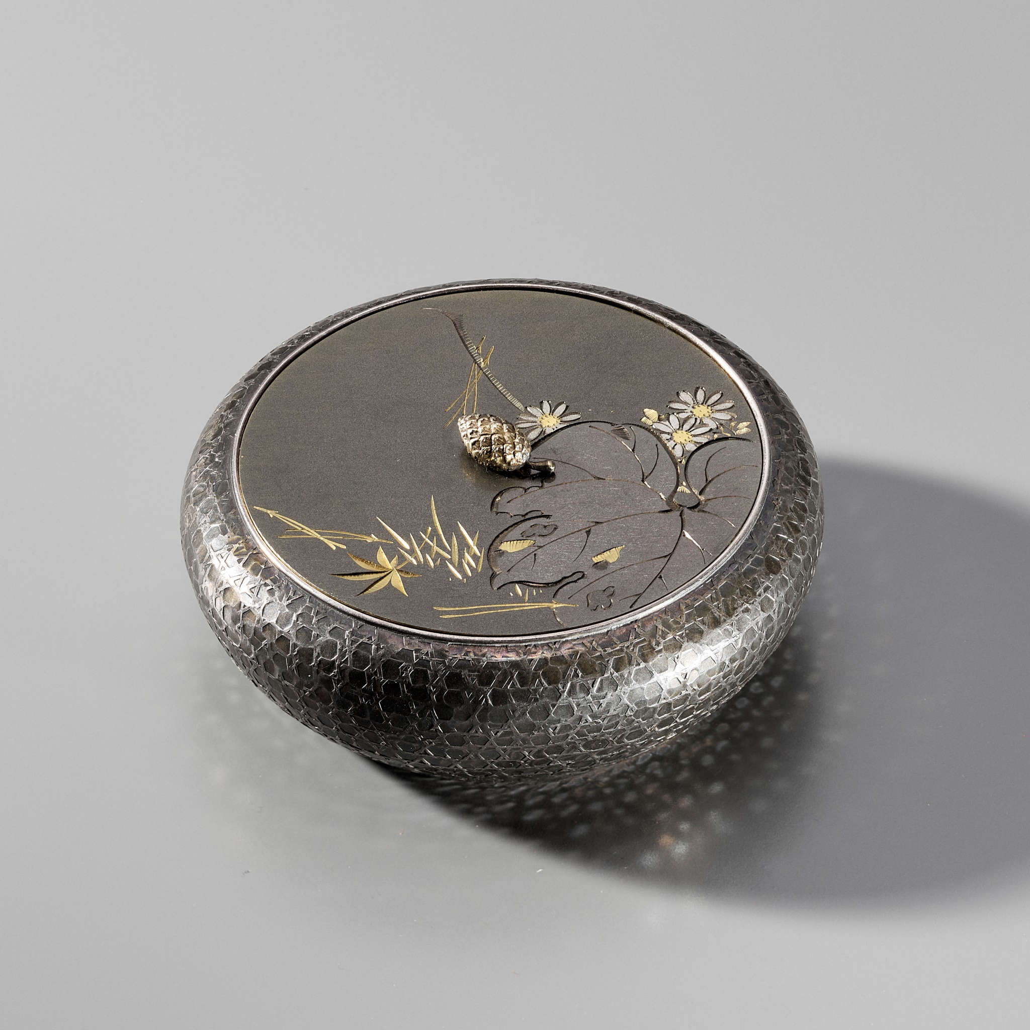 Lot 136 - HATTORI: A RARE SILVER AND MIXED METAL KOGO