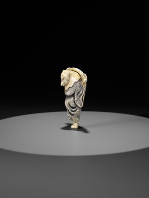 Lot 357 - AN IVORY NETSUKE OF A FOX PRIEST (HAKUZOSU) WITH BAMBOO CANE