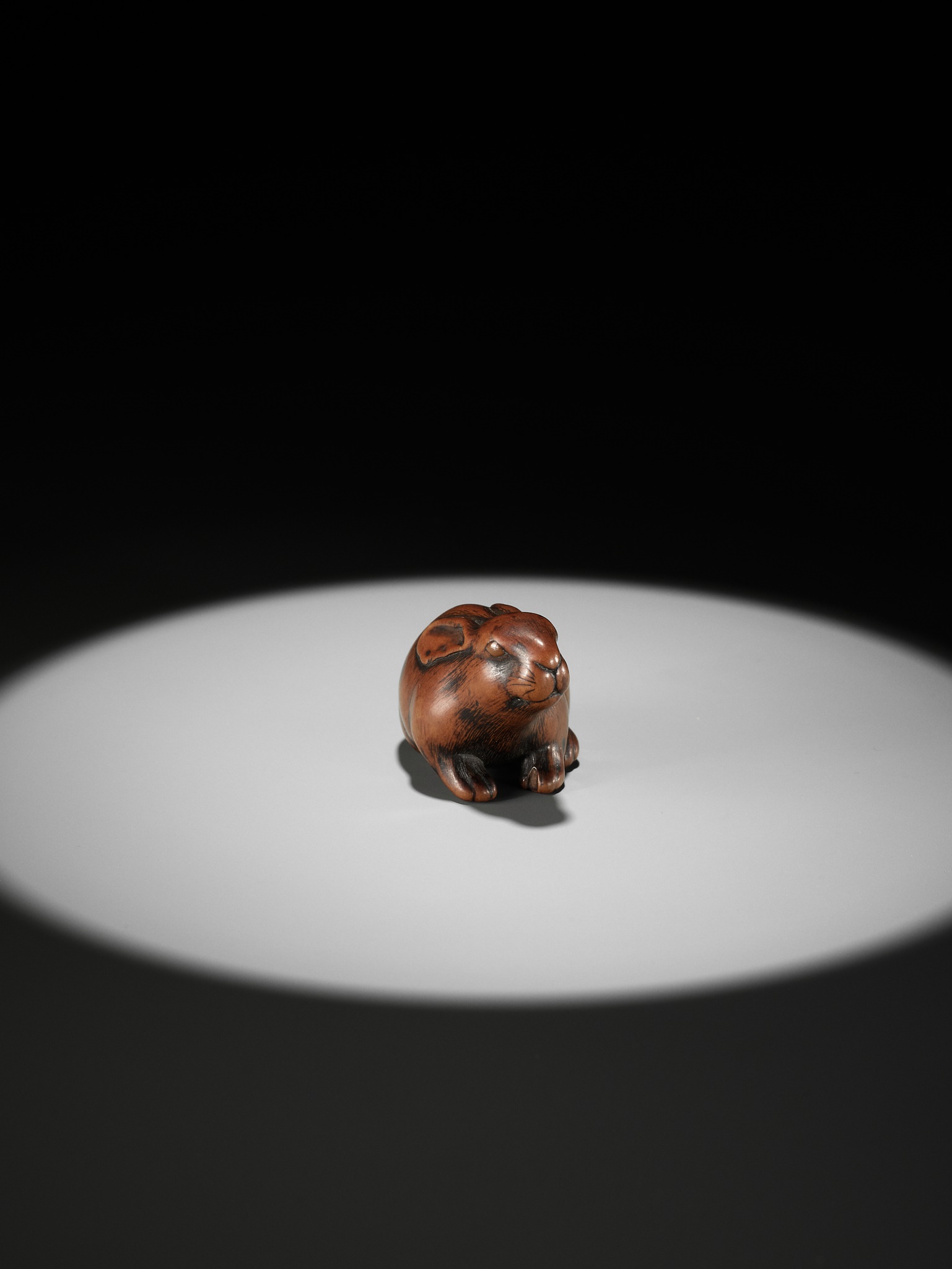 Lot 126 - MASAKATSU: A SUPERB WOOD NETSUKE OF A