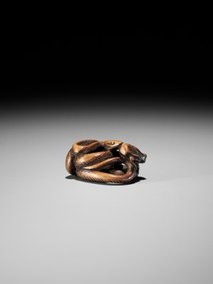 AN EARLY WOOD NETSUKE OF A SNAKE AND FROG