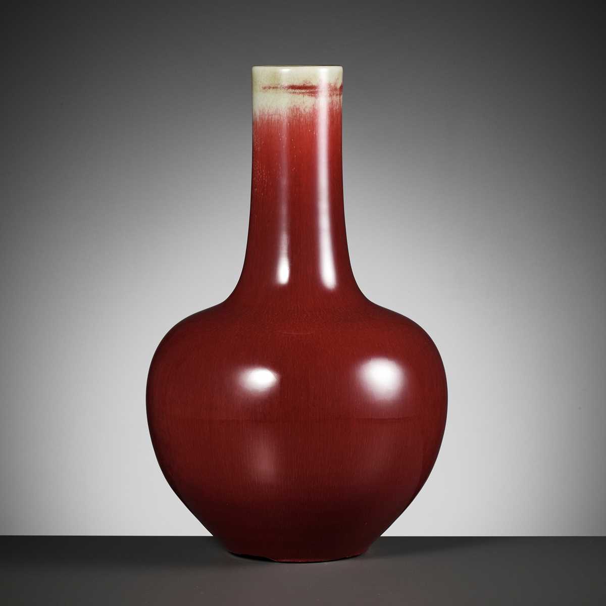 A COPPER-RED GLAZED ‘LANGYAO’ VASE, TIANQIUPING, QING DYNASTY 清代郎窯天球瓶...