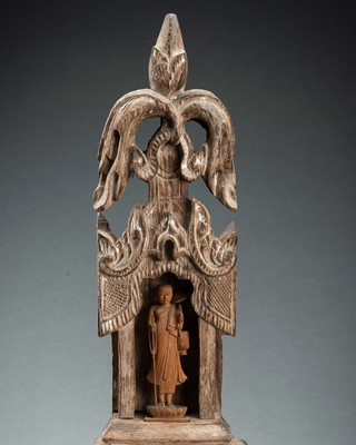 Lot 1424 - A TEAKWOOD SHRINE WITH A MONK, 19th CENTURY