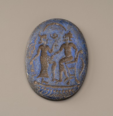 Lot 654 - A BACTRIAN LAPIS LAZULI INTAGLIO PLAQUE WITH FIGURES