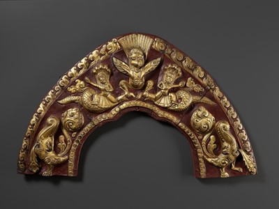 Lot 16 - A LARGE GILT AND LACQUERED COPPER REPOUSSÉ TORANA, NEPAL, 17TH-18TH CENTURY