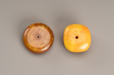 Lot 226 - TWO HIMALAYAN BEADS IN IMITATION OF AMBER