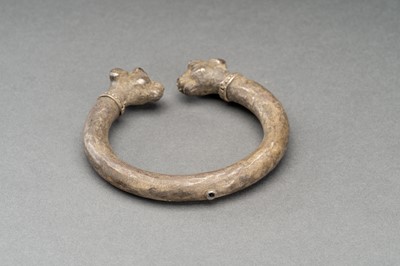 Lot 765 - AN ACHAEMENID SILVER LAMB-HEADED BRACELET