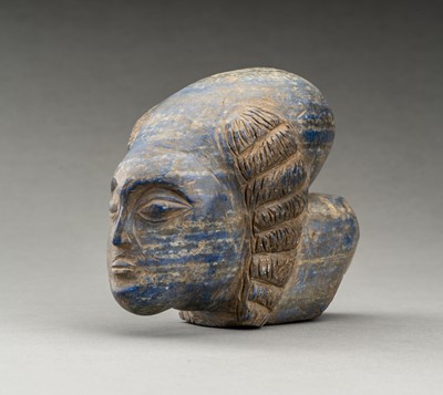 Lot 678 - A GRECO-BACTRIAN STYLE LAPIS LAZULI HEAD OF A DEITY