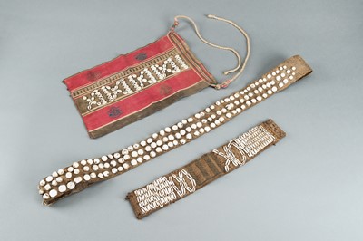 Lot 717 - LOT WITH TWO TRIBAL NAGALAND SHELL STUDDED BELTS AND AN APRON, c. 1900s