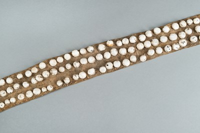 Lot 717 - LOT WITH TWO TRIBAL NAGALAND SHELL STUDDED BELTS AND AN APRON, c. 1900s