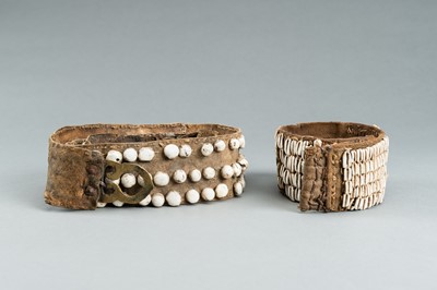 Lot 717 - LOT WITH TWO TRIBAL NAGALAND SHELL STUDDED BELTS AND AN APRON, c. 1900s