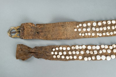 Lot 717 - LOT WITH TWO TRIBAL NAGALAND SHELL STUDDED BELTS AND AN APRON, c. 1900s