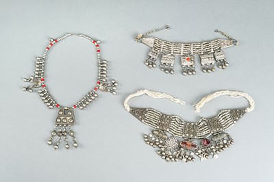 Lot 738 - A GROUP OF THREE WHITE METAL LAZEM AMULET NECKLACES, c 1930s