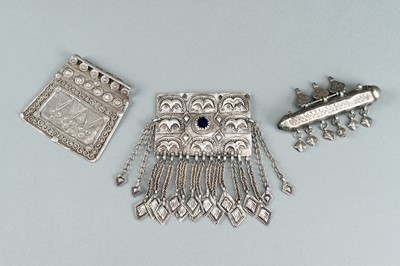 Lot 739 - A GROUP OF THREE SILVER AND METAL PENDANTS, c. 1900s