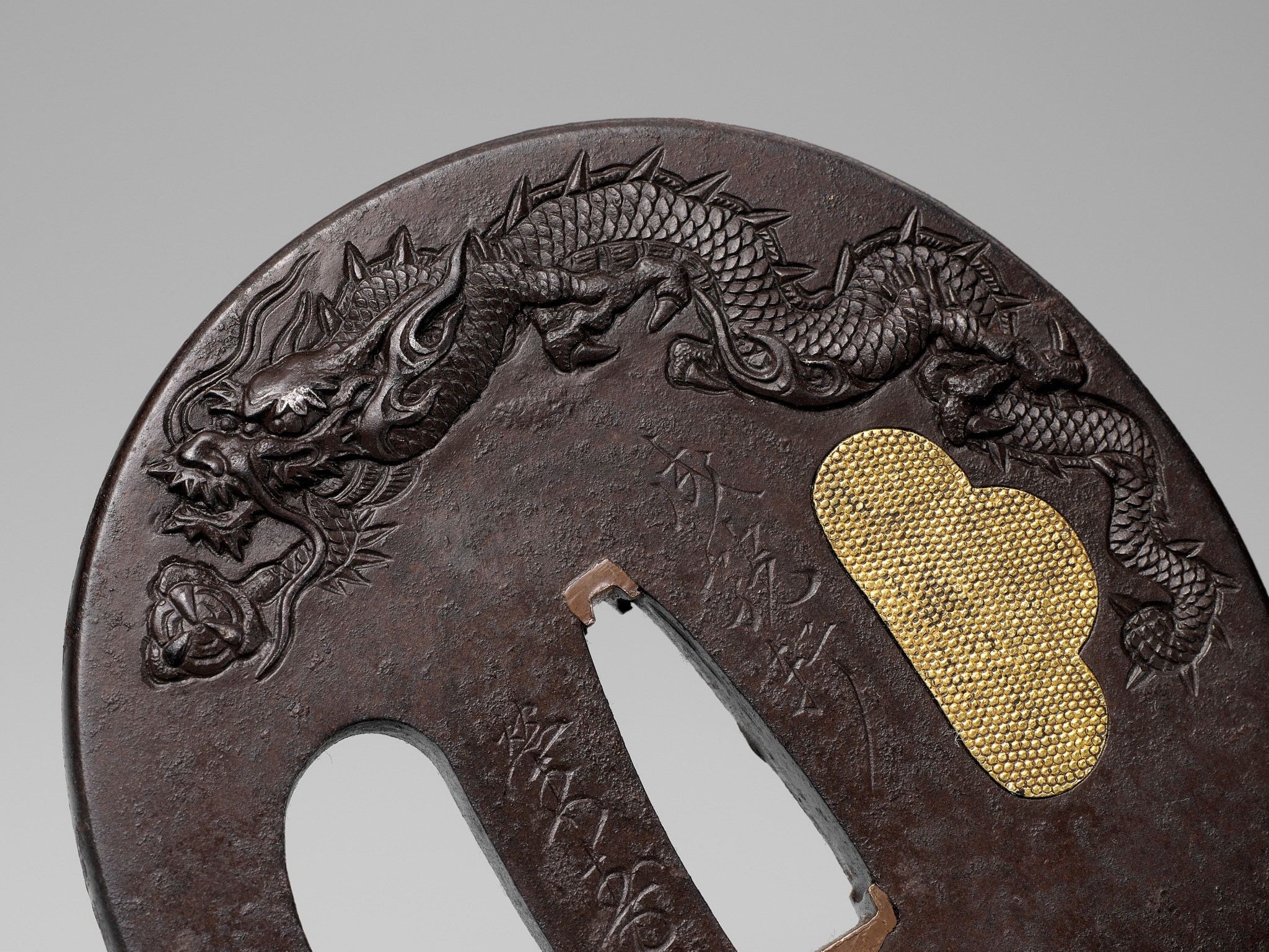 Lot 193 - SEIRYUKEN EIJU: A LARGE IRON TSUBA WITH