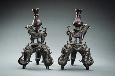 Lot 150 - A PAIR OF FIGURAL CHINESE BRONZE LAMP STANDS, MING DYNASTY