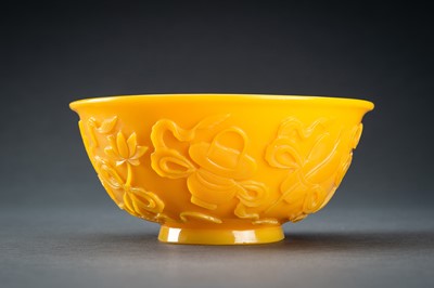 Lot 48 - AN OPAQUE YELLOW GLASS BOWL WITH BUDDHIST SYMBOLS, QING