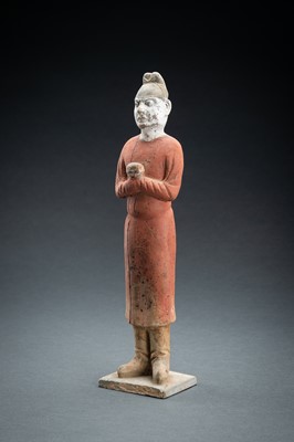 Lot 63 - A RARE POTTERY FIGURE OF A COURT SERVANT, TANG DYNASTY