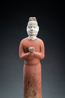 Lot 63 - A RARE POTTERY FIGURE OF A COURT SERVANT, TANG DYNASTY
