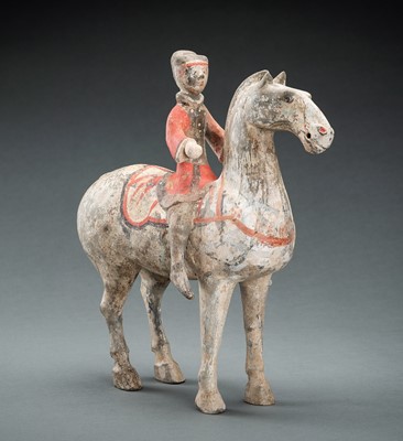 Lot 299 - A POTTERY FIGURE OF AN EQUESTRIAN, HAN DYNASTY