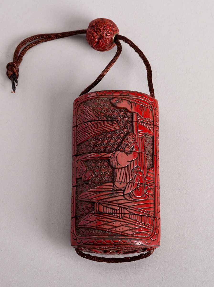 Lot 483 - A TSUISHU RED LACQUER FOUR-CASE INRO WITH