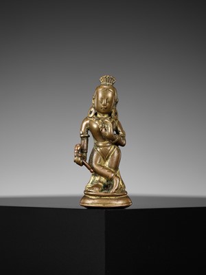 Lot 182 - A COPPER-INLAID COPPER ALLOY FIGURE OF DEVI, NEPAL, 10TH-11TH CENTURY