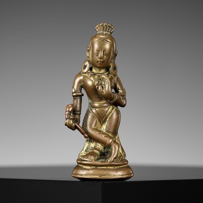 Lot 182 - A COPPER-INLAID COPPER ALLOY FIGURE OF DEVI, NEPAL, 10TH-11TH CENTURY