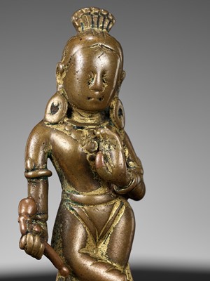 Lot 182 - A COPPER-INLAID COPPER ALLOY FIGURE OF DEVI, NEPAL, 10TH-11TH CENTURY