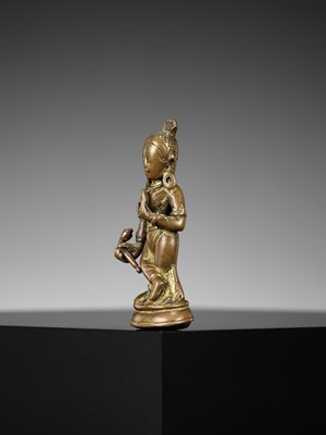 Lot 182 - A COPPER-INLAID COPPER ALLOY FIGURE OF DEVI, NEPAL, 10TH-11TH CENTURY