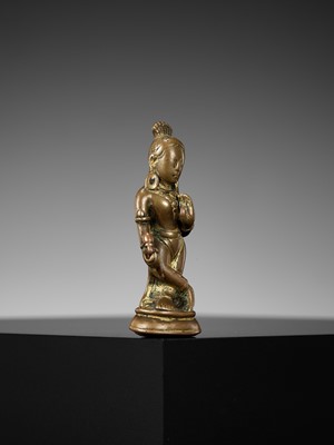 Lot 182 - A COPPER-INLAID COPPER ALLOY FIGURE OF DEVI, NEPAL, 10TH-11TH CENTURY