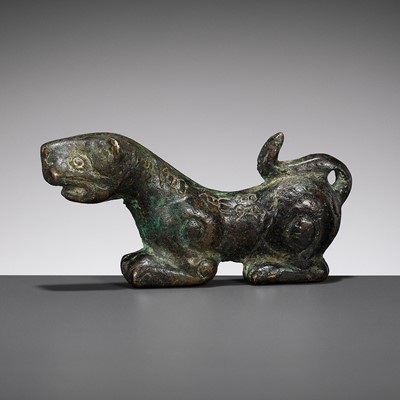 Lot 306 - AN INSCRIBED HALF OF A BRONZE TIGER TALLY, EASTERN HAN DYNASTY