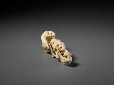 Lot 293 - KOZAN: AN IVORY OKIMONO OF THREE FIGHTING LIONS
