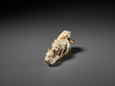 Lot 293 - KOZAN: AN IVORY OKIMONO OF THREE FIGHTING LIONS