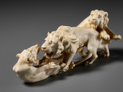 Lot 293 - KOZAN: AN IVORY OKIMONO OF THREE FIGHTING LIONS