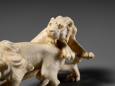 Lot 293 - KOZAN: AN IVORY OKIMONO OF THREE FIGHTING LIONS