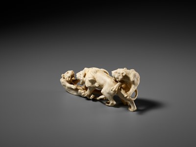 Lot 293 - KOZAN: AN IVORY OKIMONO OF THREE FIGHTING LIONS