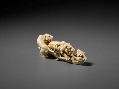 Lot 293 - KOZAN: AN IVORY OKIMONO OF THREE FIGHTING LIONS