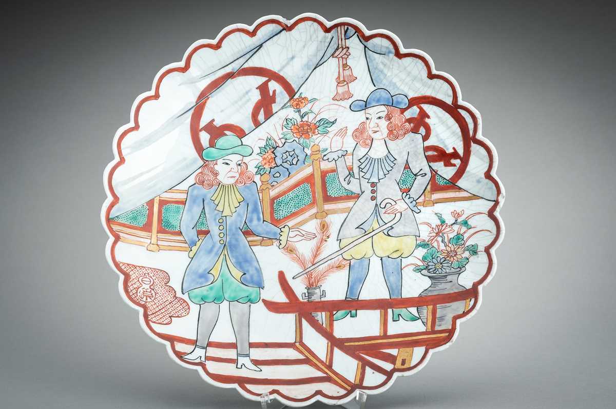 Lot 97 - AN IMARI NANBAN LOBED PORCELAIN DISH WITH DUTCHMEN, MEIJI