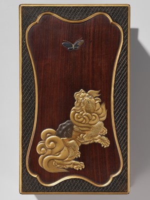 Lot 26 - A RARE LACQUERED WOOD SUZURIBAKO (WRITING BOX) DEPICTING A SHISHI AND BUTTERFLY