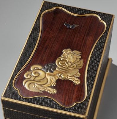 Lot 26 - A RARE LACQUERED WOOD SUZURIBAKO (WRITING BOX) DEPICTING A SHISHI AND BUTTERFLY
