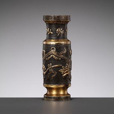 Lot 617 - A PARCEL-GILT BRONZE TOOL VASE BY HU WENMING, MING DYNASTY