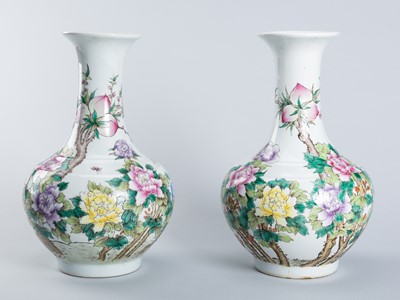 Lot 1359 - A PAIR OF ‘PEONIES AND PEACHES’ PORCELAIN VASES, c. 1920s