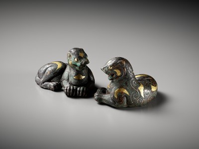 Lot 144 - A PAIR OF SILVER- AND GOLD-INLAID BRONZE ‘TIGER’ WEIGHTS, HAN DYNASTY