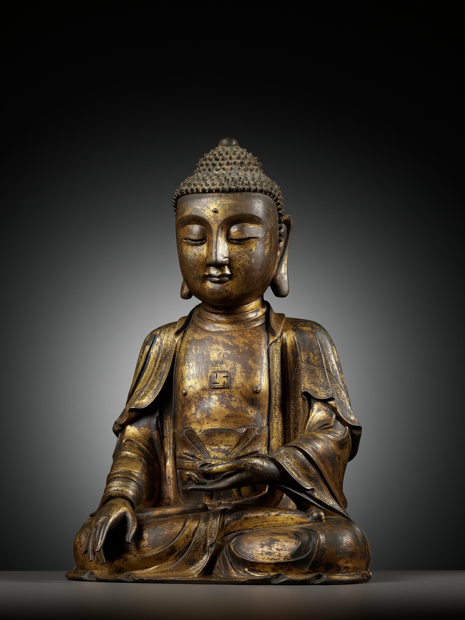 Lot 189 - A LARGE GILT BRONZE FIGURE OF BUDDHA, MING