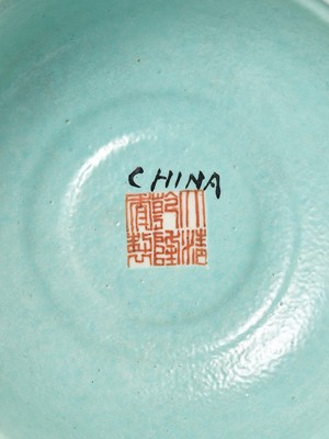 Lot 540 - A PAIR OF LARGE RUBY-GROUND FAMILLE ROSE BUDDHIST EMBLEM ALTAR ORNAMENTS, QING DYNASTY