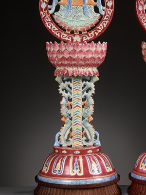 Lot 540 - A PAIR OF LARGE RUBY-GROUND FAMILLE ROSE BUDDHIST EMBLEM ALTAR ORNAMENTS, QING DYNASTY