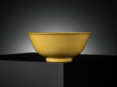 Lot 113 - AN IMPERIAL YELLOW-GLAZED AND INCISED ‘DRAGON’ BOWL, QIANLONG MARK AND PERIOD