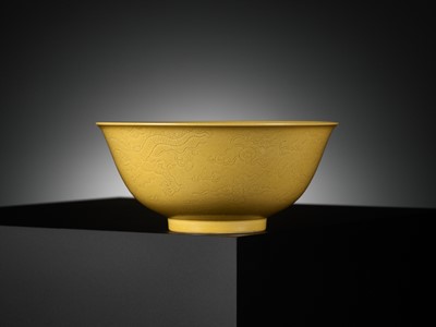 Lot 113 - AN IMPERIAL YELLOW-GLAZED AND INCISED ‘DRAGON’ BOWL, QIANLONG MARK AND PERIOD