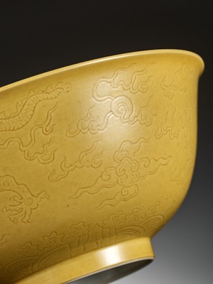 Lot 113 - AN IMPERIAL YELLOW-GLAZED AND INCISED ‘DRAGON’ BOWL, QIANLONG MARK AND PERIOD