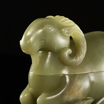 Lot 27 - A CARVED CELADON JADE BOX AND COVER IN THE FORM OF A RAM, QING DYNASTY